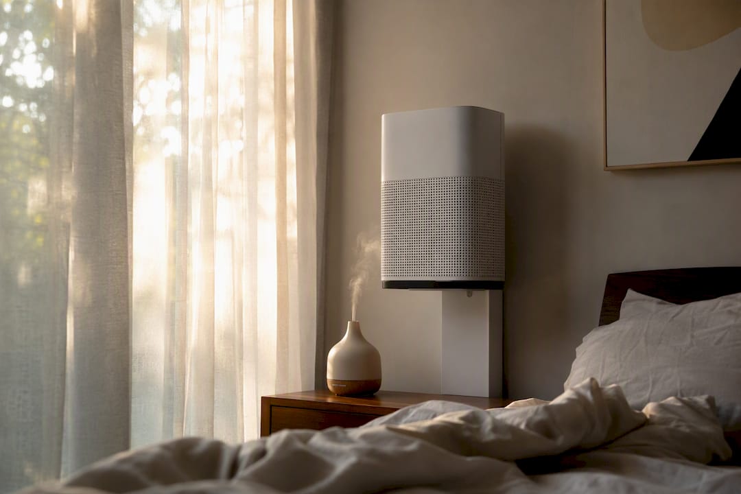 Elevated air purifier on nightstand by bed